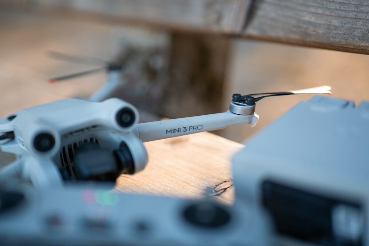 A drone and its remote control are in focus.