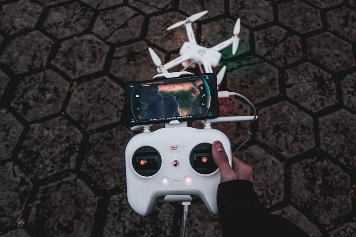 white drone and controller